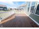 An exterior wooden deck with white railing offers an outdoor space for relaxation and entertaining at 2314 Angelina Way, Greenwood, IN 46143