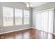 Bright dining room featuring big windows with backyard views and modern chandelier at 2314 Angelina Way, Greenwood, IN 46143