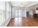 Cozy dining area with big windows, sliding door, and connection to living room with fireplace at 2314 Angelina Way, Greenwood, IN 46143