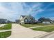 Well-maintained home with a long driveway, attached garage, and a lush green lawn at 2314 Angelina Way, Greenwood, IN 46143