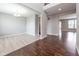 Open-concept living space featuring hardwood floors, bright lighting, and neutral paint at 2314 Angelina Way, Greenwood, IN 46143