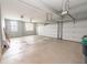 A spacious garage with ample room for parking and storage featuring two overhead doors at 2314 Angelina Way, Greenwood, IN 46143