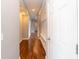 Long hallway with hardwood floors and white trim at 2314 Angelina Way, Greenwood, IN 46143