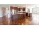 Open kitchen with stainless steel appliances, granite countertops and large central island at 2314 Angelina Way, Greenwood, IN 46143