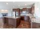 Gourmet kitchen featuring a spacious island, granite countertops, and stainless steel appliances at 2314 Angelina Way, Greenwood, IN 46143