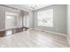 Cozy living room with tile flooring, plenty of natural light, and a simple chandelier at 2314 Angelina Way, Greenwood, IN 46143