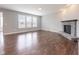 Bright living room featuring a stone fireplace and large windows at 2314 Angelina Way, Greenwood, IN 46143