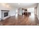 Open floor plan with fireplace, kitchen, and large windows, creating a light and airy feel at 2314 Angelina Way, Greenwood, IN 46143