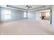 Spacious main bedroom with tray ceiling, ceiling fan, and plenty of natural light from multiple windows at 2314 Angelina Way, Greenwood, IN 46143