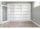 A large built-in bookshelf offers tons of storage and character in this modern office space at 2314 Angelina Way, Greenwood, IN 46143
