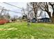 Lush backyard with garden shed and mature trees at 2315 Cardinal Dr, Indianapolis, IN 46227