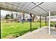 Covered patio overlooking a large yard with lush green grass at 2315 Cardinal Dr, Indianapolis, IN 46227