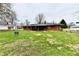 Brick home with a well-manicured backyard, offering a serene and private outdoor space at 2315 Cardinal Dr, Indianapolis, IN 46227