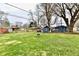 Spacious backyard featuring two sheds and a fire pit, perfect for outdoor gatherings at 2315 Cardinal Dr, Indianapolis, IN 46227