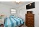 This bedroom features a flat-screen TV, dresser, and ample closet space at 2315 Cardinal Dr, Indianapolis, IN 46227
