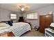 Relaxing bedroom featuring a bed, spacious closet, and a flat-screen TV at 2315 Cardinal Dr, Indianapolis, IN 46227