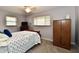 Comfortable bedroom features a flat-screen TV, large closet, and generous natural light from the window at 2315 Cardinal Dr, Indianapolis, IN 46227