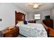 Cozy bedroom featuring a striking wooden headboard and a ceiling fan at 2315 Cardinal Dr, Indianapolis, IN 46227