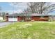 Charming single-story brick home with attached garage and well-maintained front yard at 2315 Cardinal Dr, Indianapolis, IN 46227