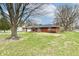 Brick home with an attached garage and a spacious front yard, providing a welcoming entrance at 2315 Cardinal Dr, Indianapolis, IN 46227