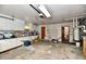 Functional garage with water heater, furnace, lots of cabinets and door to backyard at 2315 Cardinal Dr, Indianapolis, IN 46227