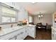 Cozy kitchen featuring white cabinets and bright lighting at 2315 Cardinal Dr, Indianapolis, IN 46227