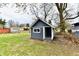 Charming backyard shed with a covered porch, adding character to the outdoor space at 2315 Cardinal Dr, Indianapolis, IN 46227