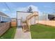 Newly constructed backyard featuring a fresh lawn, a staircase to upper level and new fence at 238 N Tacoma Ave, Indianapolis, IN 46201