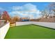 Picture of a lush, green backyard with a new fence and blue home behind it at 238 N Tacoma Ave, Indianapolis, IN 46201