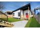 A recently renovated backyard with new fence, fresh lawn, and a new gravel walkway at 238 N Tacoma Ave, Indianapolis, IN 46201