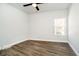 Bedroom featuring plank flooring, a ceiling fan, and a window at 238 N Tacoma Ave, Indianapolis, IN 46201