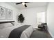 Inviting bedroom featuring neutral tones, a comfortable bed, and ample natural light from a large window at 238 N Tacoma Ave, Indianapolis, IN 46201