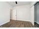 Neutral bedroom with plank flooring, closet and ceiling fan at 238 N Tacoma Ave, Indianapolis, IN 46201