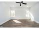 Spacious bedroom with natural light, ceiling fan, recessed lighting, and plank flooring at 238 N Tacoma Ave, Indianapolis, IN 46201