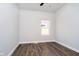 Bedroom with plank flooring and one window at 238 N Tacoma Ave, Indianapolis, IN 46201