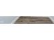 Close-up of brown plank flooring with white baseboards at 238 N Tacoma Ave, Indianapolis, IN 46201