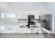 Bright kitchen features stainless steel appliances, island with sink, and white cabinets at 238 N Tacoma Ave, Indianapolis, IN 46201