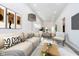 Open-concept living room boasts a cozy couch, modern decor, and a view into the dining area and kitchen at 238 N Tacoma Ave, Indianapolis, IN 46201