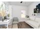 Well-designed home office with modern desk, shelving, and cozy sofa, offering a productive workspace at 238 N Tacoma Ave, Indianapolis, IN 46201