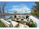 Relax on this rooftop deck with seating, stylish pillows, and a coffee table with a neighborhood view at 238 N Tacoma Ave, Indianapolis, IN 46201