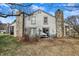 Backyard view of the home with a patio and a fireplace at 3051 Arrow Wood Ln, Indianapolis, IN 46214