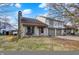 Charming two-story home with a red front door and a two-car garage nestled in a quiet neighborhood at 3051 Arrow Wood Ln, Indianapolis, IN 46214