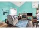 Bright living room with a stone fireplace, an accent wall, and views of the adjacent dining and kitchen areas at 3051 Arrow Wood Ln, Indianapolis, IN 46214