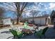 Inviting backyard with a fire pit surrounded by chairs, ideal for gatherings and outdoor enjoyment at 311 S Webster Ave, Indianapolis, IN 46219