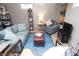 Basement living area with modern seating, area rugs, and soft lighting at 311 S Webster Ave, Indianapolis, IN 46219