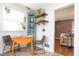 Kitchen dining area with built-in corner shelving and rustic wood shelving at 311 S Webster Ave, Indianapolis, IN 46219