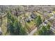 Aerial view of a home and shed with a gated yard on a tree-lined property at 3357 Saddle Club Rd, Greenwood, IN 46143