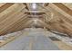 Unfinished attic space with exposed wood beams, insulation, and potential for customization at 3357 Saddle Club Rd, Greenwood, IN 46143