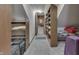 Finished attic space with carpeting, built-in shelving, and ample storage for belongings at 3357 Saddle Club Rd, Greenwood, IN 46143