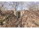 Basement entrance featuring sturdy concrete construction and natural setting at 3357 Saddle Club Rd, Greenwood, IN 46143